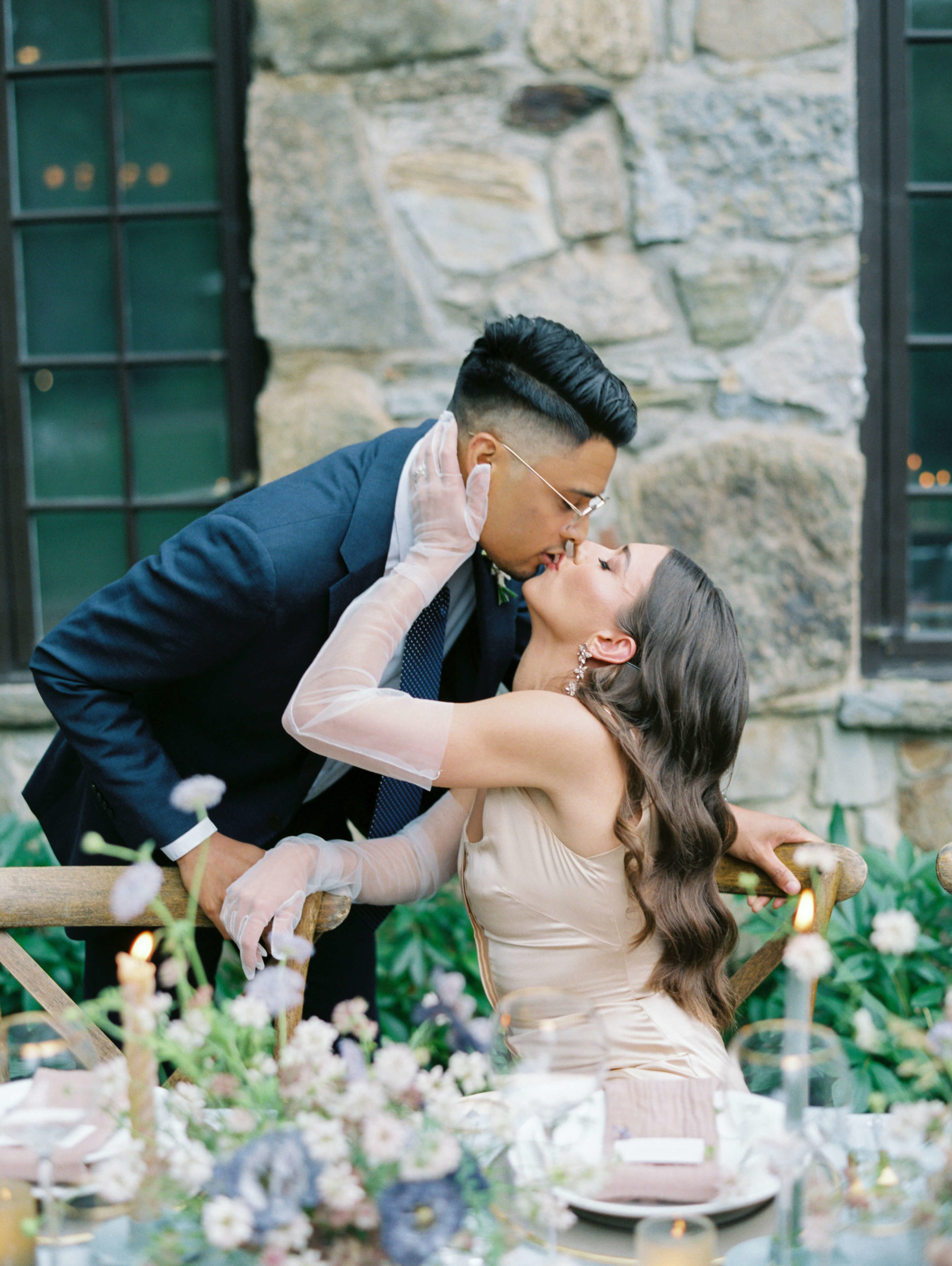 bride and groom kiss during styled shoot at Troutbeck Inn